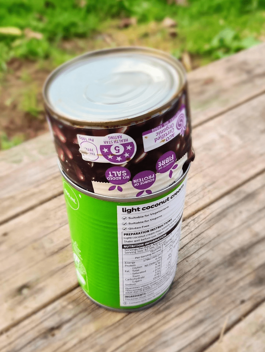 Stacked tin cans showing the DIY biochar kiln setup